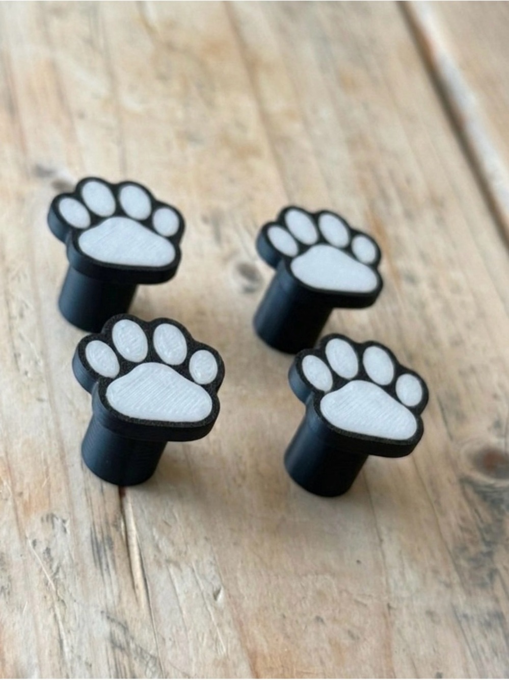 Black & White paw print tire valve caps or black and red New but no tags.